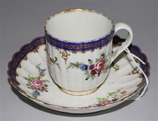 A Worcester polychrome enamel teacup and saucer, c.1770, crescent mark